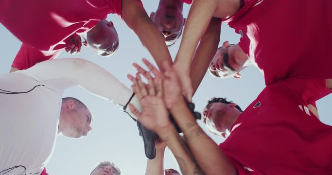 Team, soccer players and huddle with hands, boys and blue sky with low angle, support or solidarity. Energy, sports and friendship, clap and smile for motivation, ready for game or physical activity