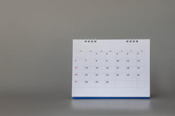 Close up calendar on gray background, planning for business meeting or travel planning concept.