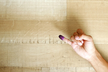 Man's little finger after voting on Indonesia's presidential election