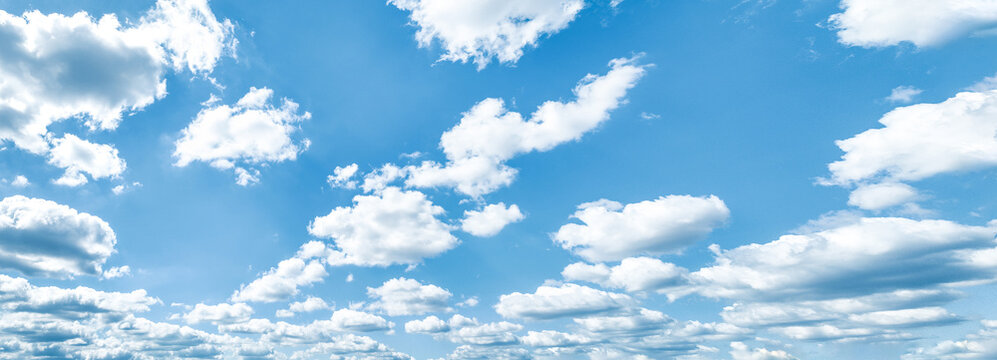 Beautiful blue sky and white cumulus clouds abstract background. Cloudscape background. Blue sky and fluffy white clouds on sunny days. Blue sky and daylight. World Ozone Day. Ozone layer. Summer sky. © Artinun