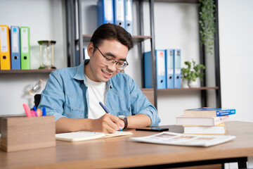 Photo of young Asian businessman at office