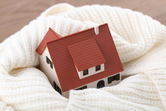 The small house model is wrapped around the neck for warmth