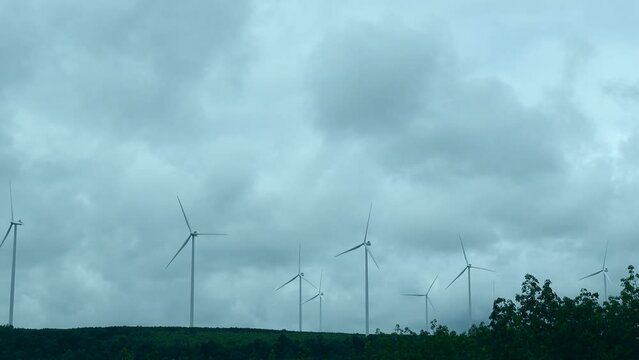 Windmill wind energy farm work well on cloudy sky sustainable alternative green enery solution