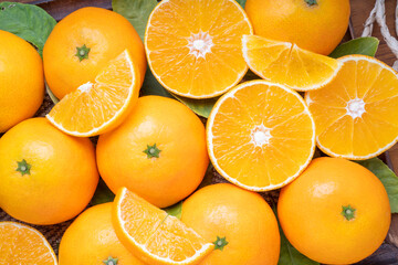 Fresh Orange fruit on wooden background, Japanese Ehime Orange with slices on wooden tray background.