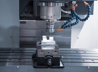 High precision CNC machining center machine cutting workpiece. Industrial metalworking manufacturing