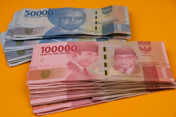 Money Indonesian Rupiah Banknotes, One hundred thousand rupiahs and Fifty thousand rupiahs, Indonesian Currency. Seratus ribu rupiah and lima puluh ribu. Finance and money background. Economy concept
