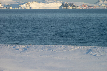 Antarctic sea and snowy land