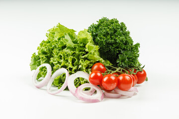 assorted fresh herbs and cherry tomatoes isolated on white