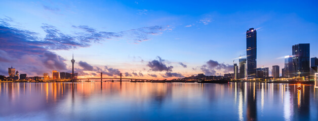 Zhuhai and Macau city skyline with modern buildings scenery at dusk, China. Famous coastline and city buildings in China.