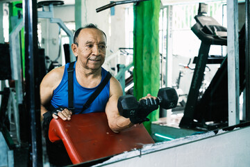 Elderly person exercising in gym