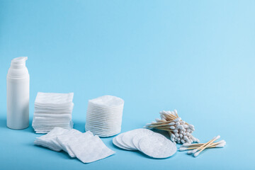 Bamboo eco-friendly cotton swabs and cotton pads of different shapes and a tube with cream or...