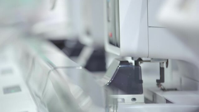 Time-lapse of a machine analyzing medical specimen inside a laboratory