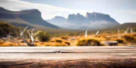 Foto auf Acrylglas Cradle Mountain The empty wooden brown table top with blur background of Cradle mountain in Tasmania. Exuberant image. generative AI