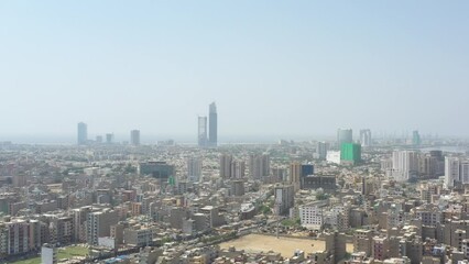 Aerial footage of the skyline of Karachi city with Bahria Opal Tower in the background, Pakistan
