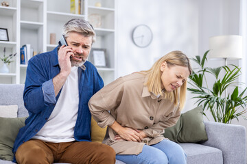 Worried husband calls an ambulance for his wife who has a stomach ache, husband calls on the phone...
