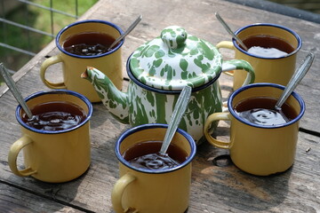 Teh Poci Gula Batu, Teko Blirik. is hot tea sweetened with rock sugar, served with an antique...