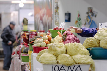 A Man in the Market: Exploring Fresh, Colorful Fruits and Vegetables