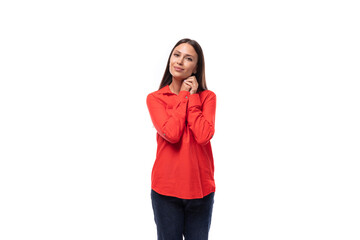 portrait of a young caucasian brunette office worker woman dressed in a red blouse on a white...