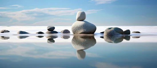 Foto op Plexiglas abstract art piece, a white splash of water contrasts against the isolated beachs serene background, evoking the peaceful nature of summer and inviting a sense of meditation while showcasing the rock © TheWaterMeloonProjec