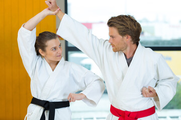 portrait of couple doing karate