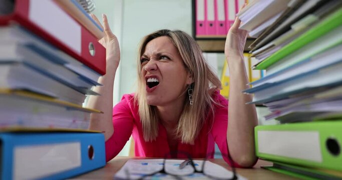 Secretary office worker working with stack of papers unfinished accounting documents