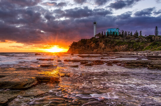 The view of the Point Cartwright Lighthouse in the sunrise from Mooloolaba beach