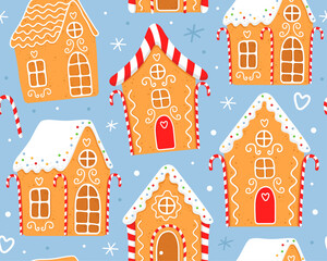 Seamless pattern with gingerbread houses on a blue background. Gingerbread houses with white sugar glaze. Red white striped christmas candles. Design for wrapping paper, fabric, textile, decor.
