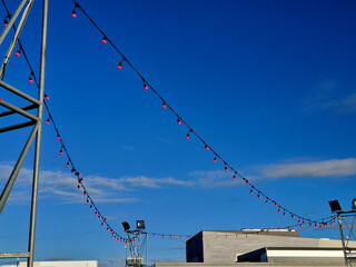 The decoration of the celebration is not possible without a lot of lights on the chain. wedding with party tents and lots of light bulbs shining in the evening while dancing on the dance floor