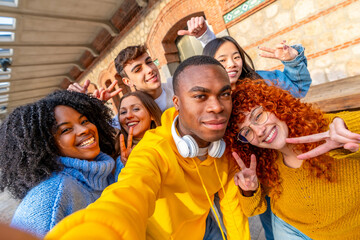 African man and cool friends taking a selfie outdoors