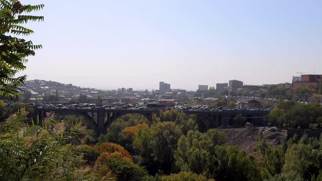 Victory (Haghtanak, Pobeda) Bridge in the Hrazdan Gorge, featuring bustling traffic on a clear, sunny, and windy autumn day, uhd, 4k, 3840, 2160