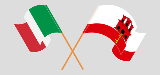 Crossed and waving flags of Italy and Gibraltar