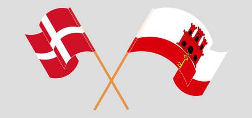 Crossed and waving flags of Denmark and Gibraltar - obrazy, fototapety, plakaty