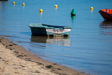 View on Arcachon Bay with many fisherman's boats and oysters farms near Le Phare du Cap Ferret, Cap...
