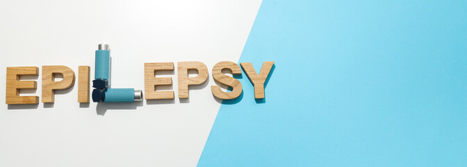 Epilepsy day written in wooden letters with inhalers - obrazy, fototapety, plakaty