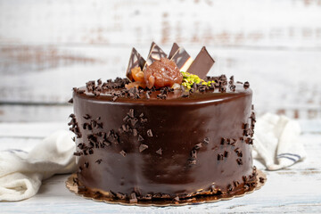 Birthday cake. Chocolate and cream cake on a white background