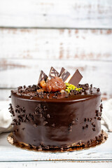 Birthday cake. Chocolate and cream cake on a white background. Close up