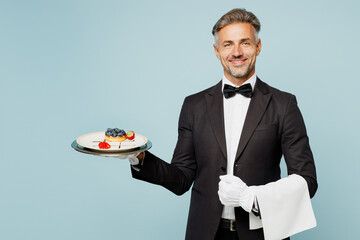 Adult barista male waiter butler man wear shirt black suit bow tie elegant uniform hold in hand...