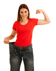 beautiful young woman holds too big trousers as she lost weight isolated without background png - 692926493