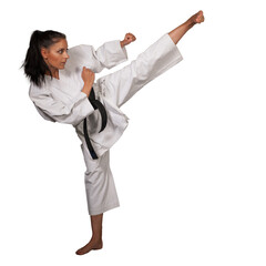 Woman in white  kimono kicks high in the air -  a karate  martial art girl - 692926628
