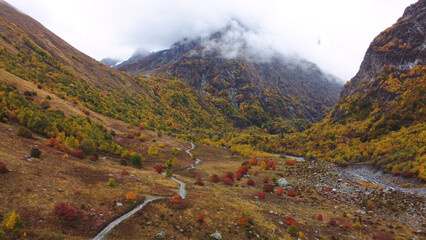 the road in the autumn mountains of the Caucasus behind the fog
