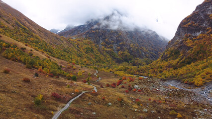 the road in the autumn mountains of the Caucasus behind the fog