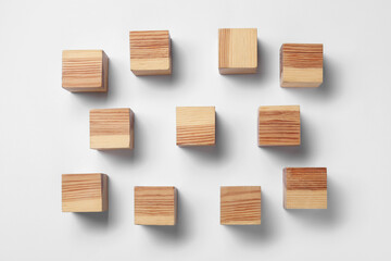 Blank wooden cubes on white background, flat lay