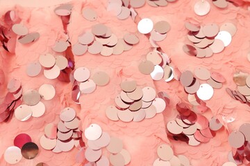 Texture of stylish pink carnival dress with sequins as background, closeup