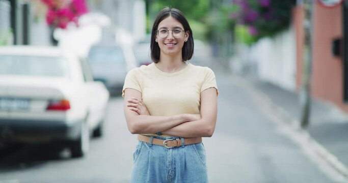 Woman, face and arms crossed for confidence smile as small business entrepreneur, city professional or company job. Female person, manager and happy in road as employee for pride, startup or outdoor