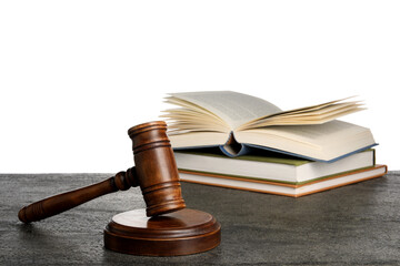 Law concept. Judge's mallet and books on dark grey table against white background