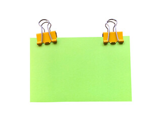 green sticky note with binder clip on white background isolated