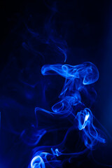Blue smoke motion on black background. - 692937835
