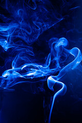 Blue smoke motion on black background. - 692937842