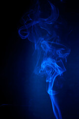 Blue smoke motion on black background. - 692937851