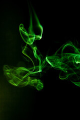 Green smoke motion on black background. - 692937872